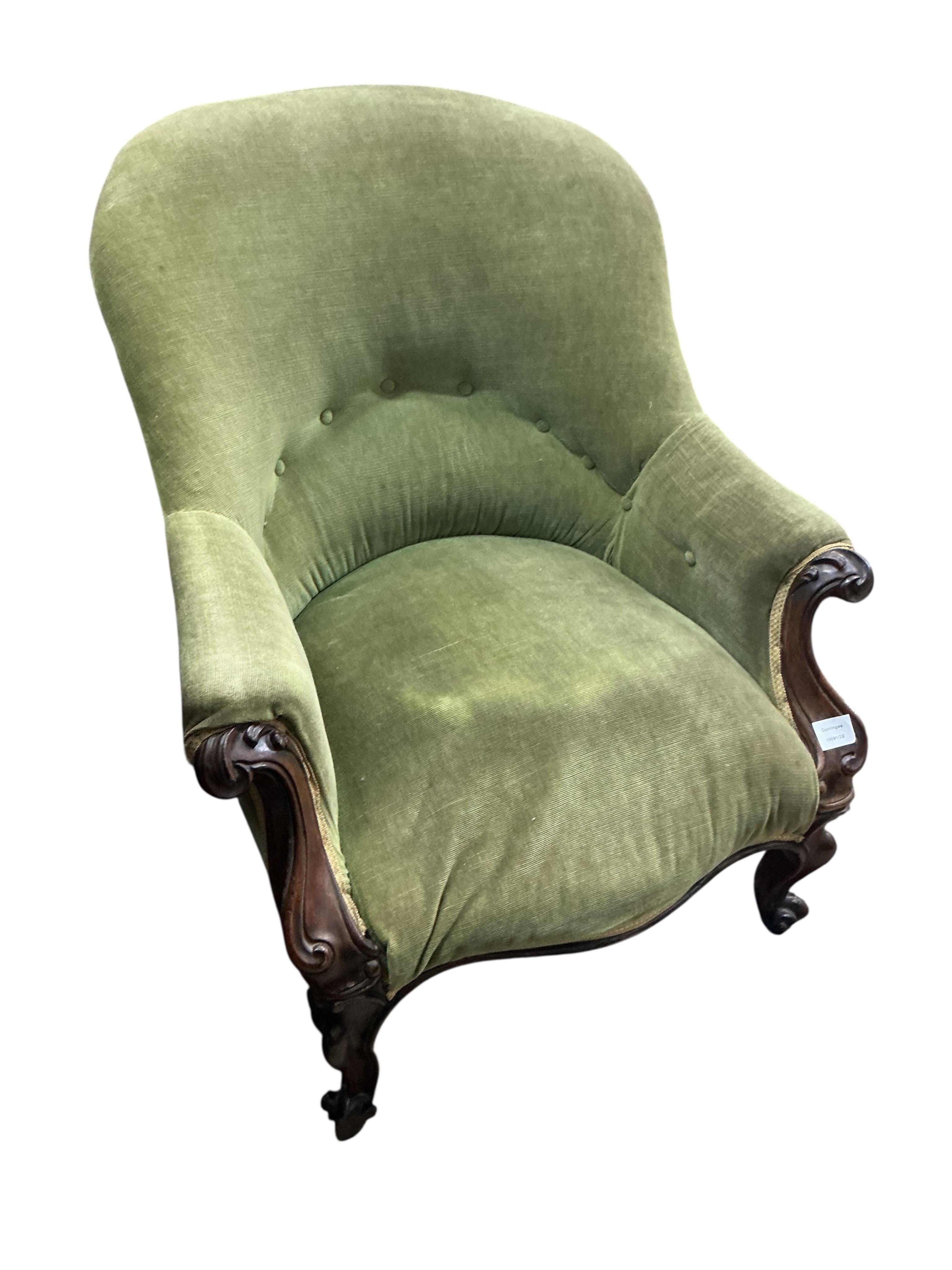 A Victorian mahogany upholstered spoonback armchair, width 74cm, depth 72cm, height 82cm
